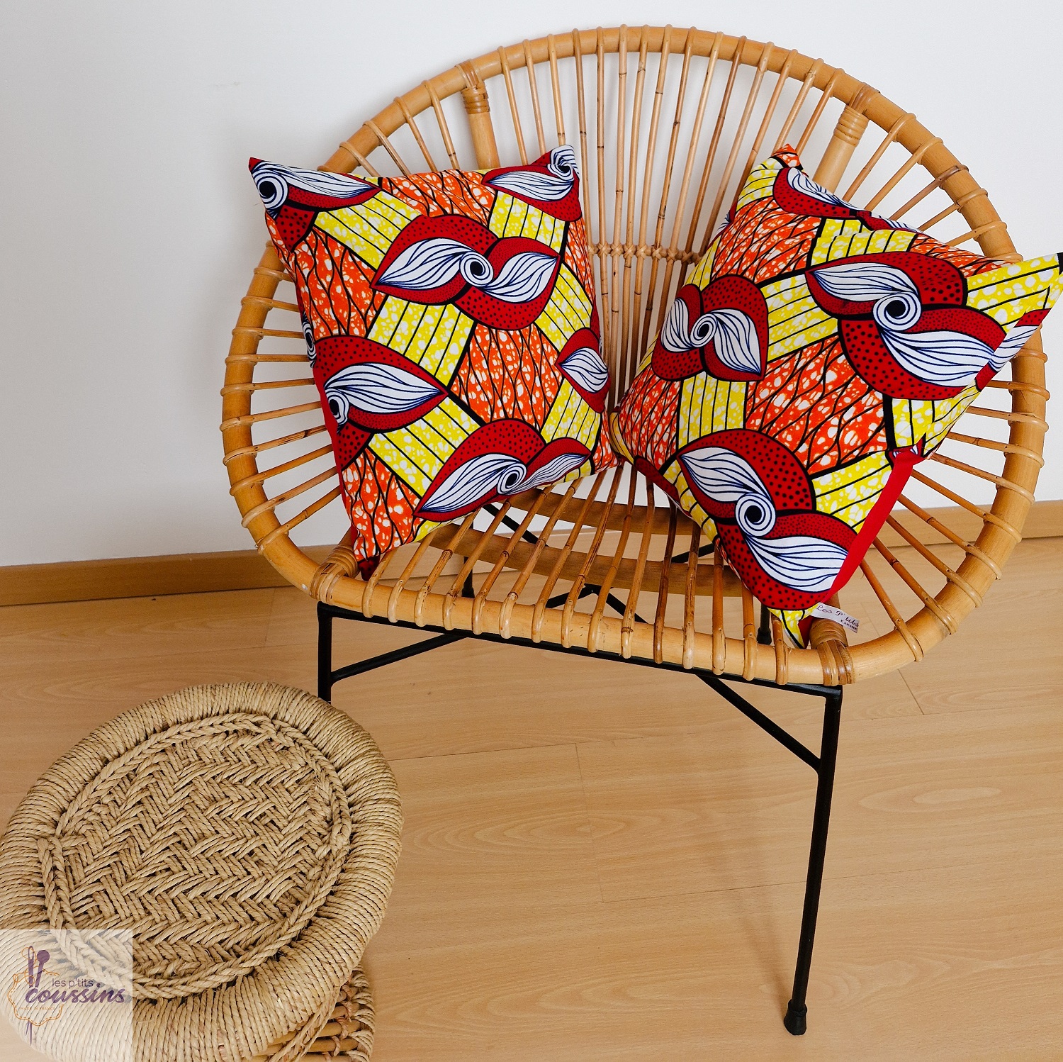 coussin en wax en rouge, jaune, orange les ptits coussins